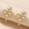 Retro Exaggerated Hollow Pearl Twist Love Stud Earrings