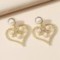 Retro Exaggerated Hollow Pearl Twist Love Stud Earrings