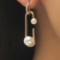 Pin statement pearl earrings