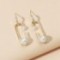 Pin statement pearl earrings