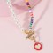 Multi-Colored Ceramic Fragments and Pearl Necklace